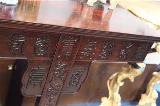 A large Chinese Hundred Shou rosewood (hongmu) altar table, early 20th century, length 258cm, depth 50cm, height 93.5cm, restorations